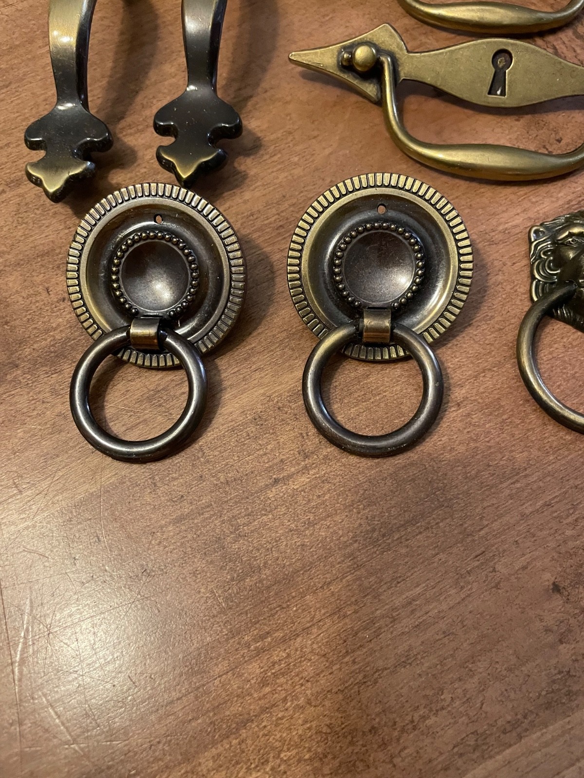 variety of vintage brass pieces, door knock, handles, and pulls never used