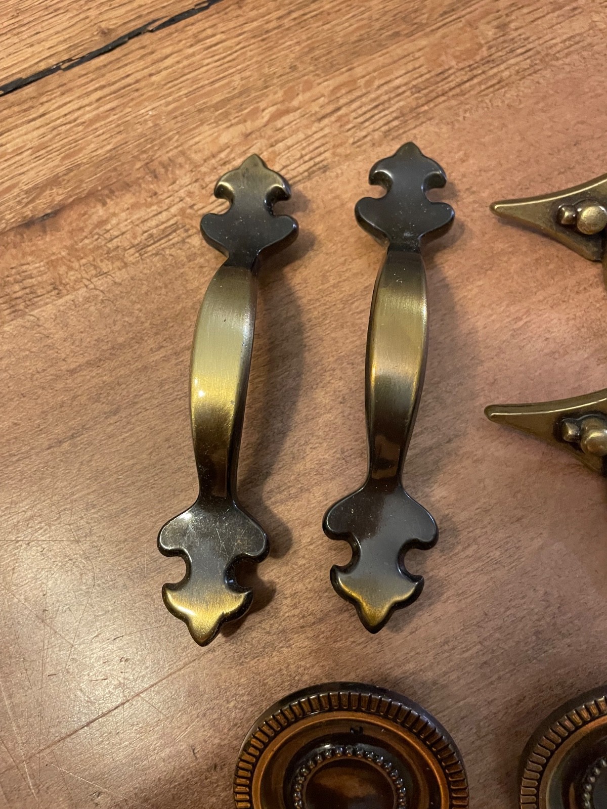 variety of vintage brass pieces, door knock, handles, and pulls never used