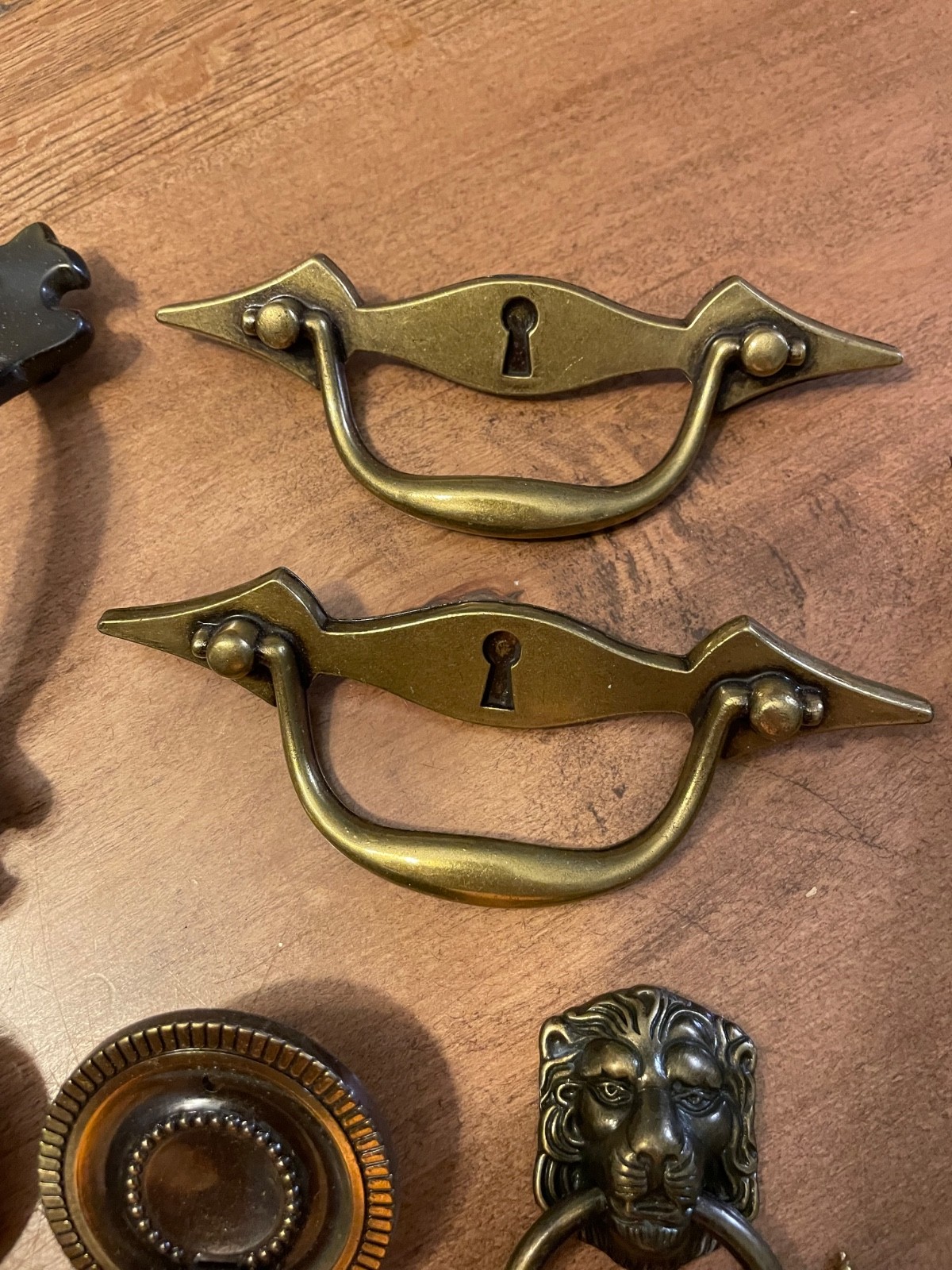 variety of vintage brass pieces, door knock, handles, and pulls never used