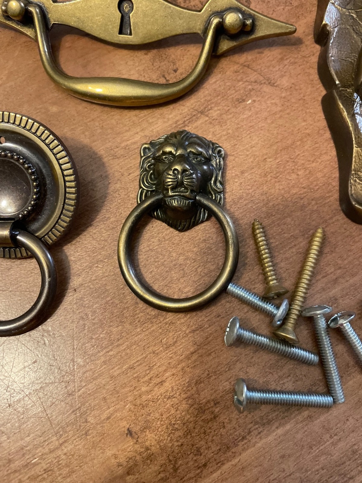 variety of vintage brass pieces, door knock, handles, and pulls never used