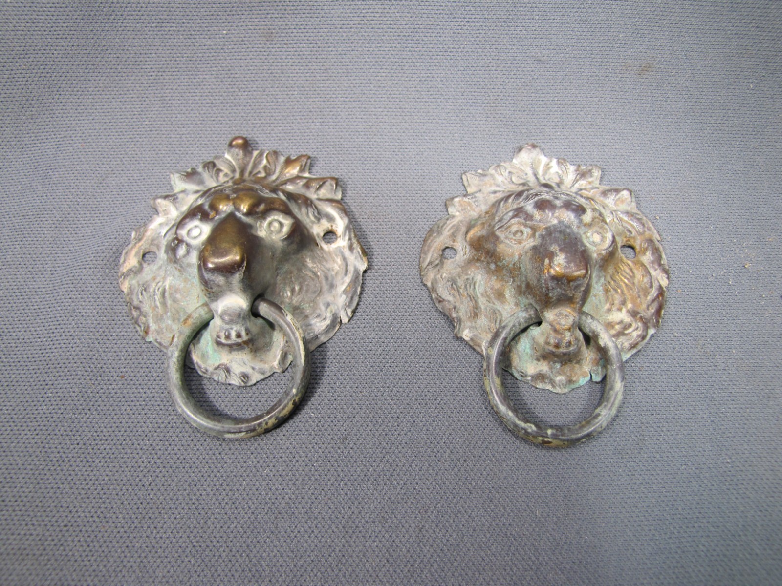 2 antique stamped brass lionhead drawer pulls with Ring