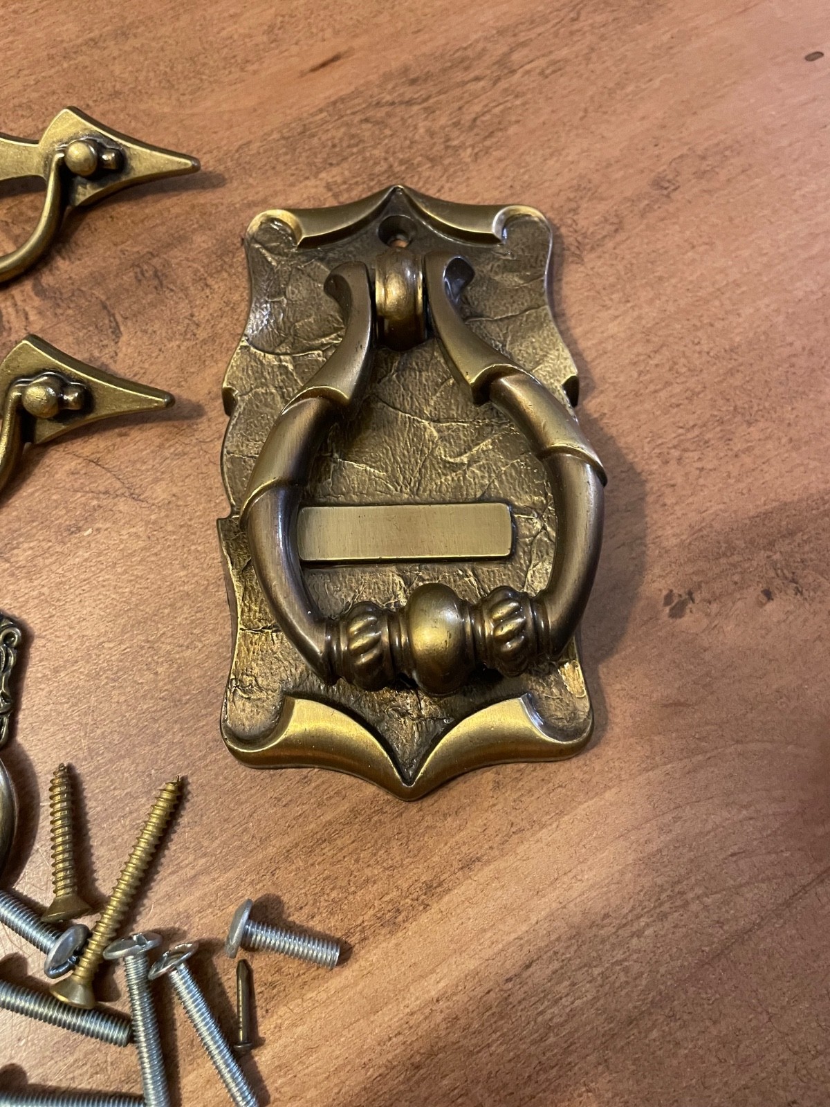 variety of vintage brass pieces, door knock, handles, and pulls never used