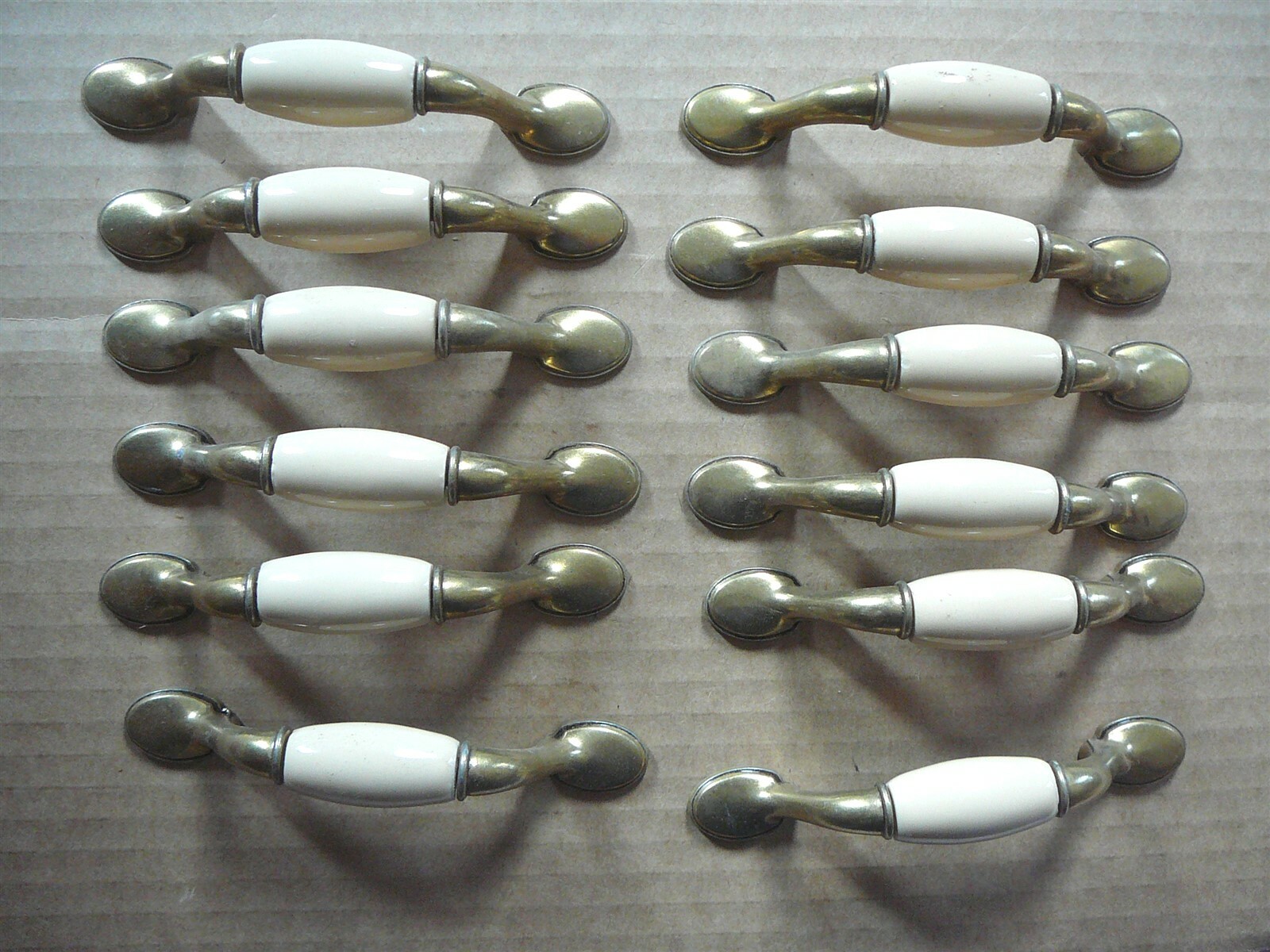 SET of TWELVE BRASS TONE METAL & BEIGE WHITE DRAWER DOOR PULLS Vintage 3″CL NWOB