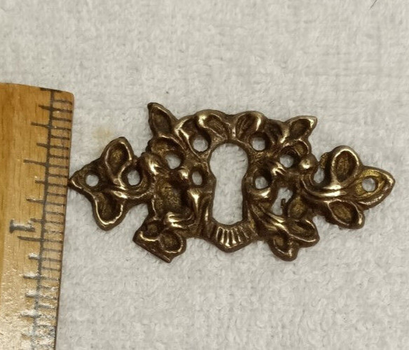 ANTIQUE CAST BRASS ESCUTCHEON OR KEYHOLE COVER,VICTORIAN ERA DESIGN,GOOD PATINA