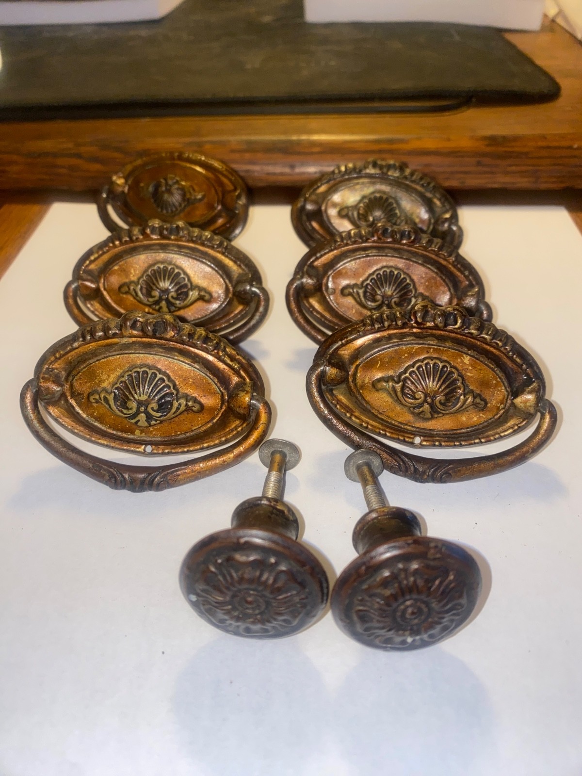 Antique set of 8 Hepplewhite pulls. 6 – 2 3/8″ drop downs and 2 – 1″ knobs .