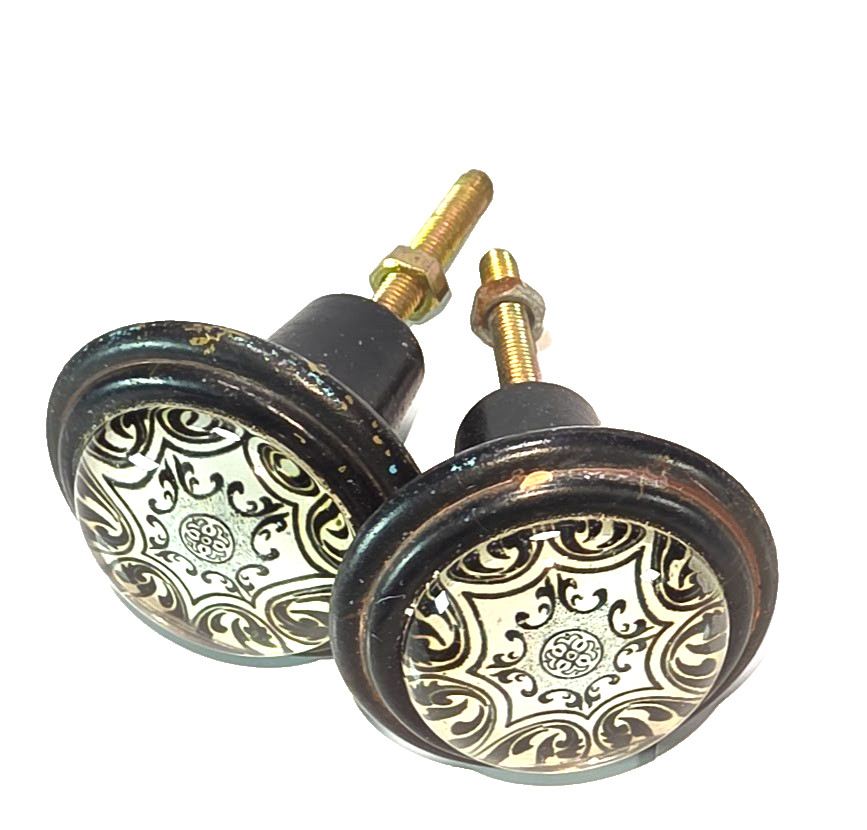 Set of 2 Black Cast Iron with White and Black Geometric Design Under Glass Knobs