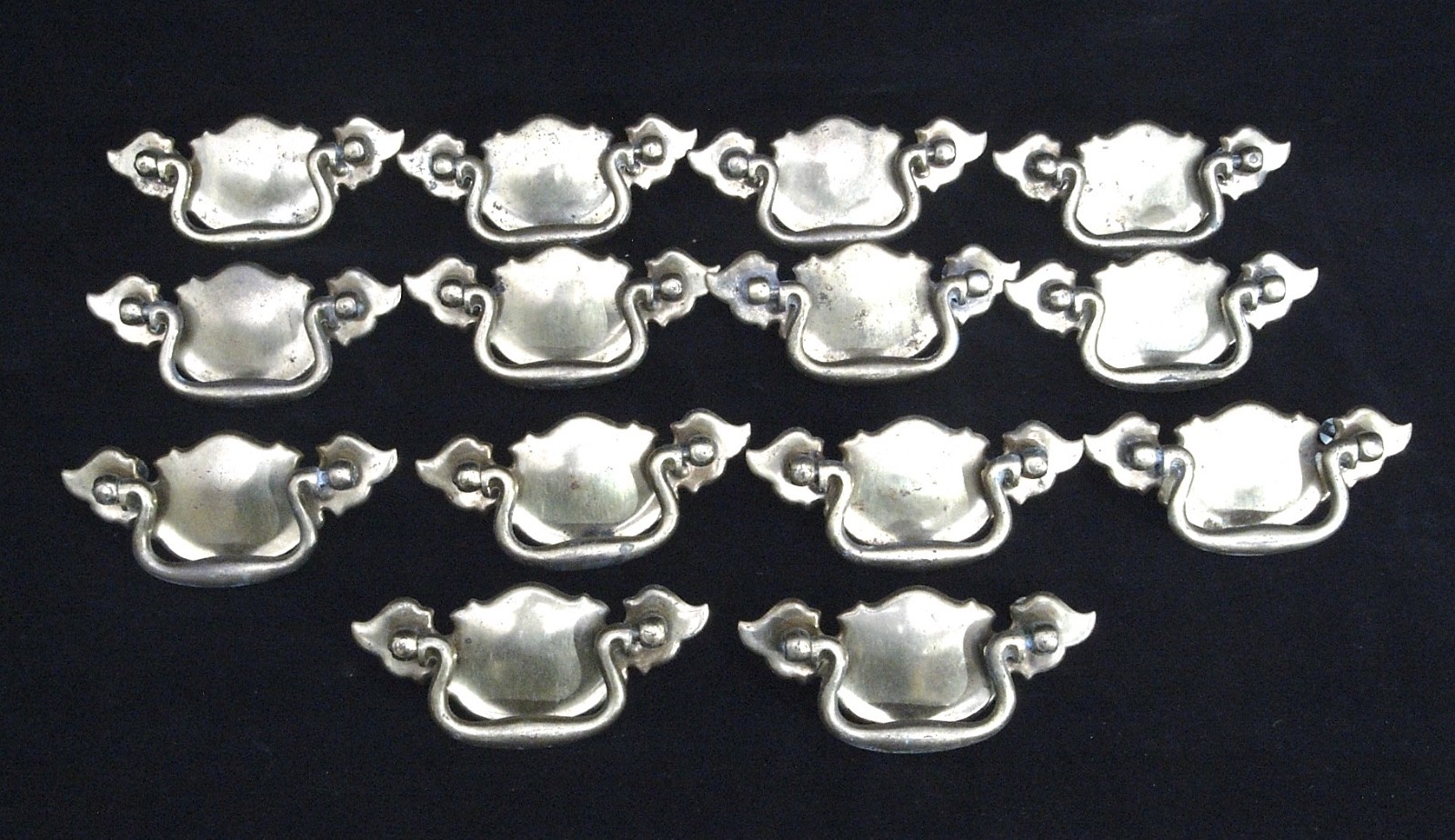 14 CHIPPENDALE BATWING BRASS TONED METAL CABINET PULLS IN VERY GOOD CONDITION