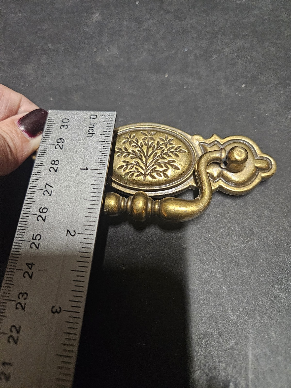 Vintage Bail Pull Features An Ornate Oval Backplate With Floral Design
