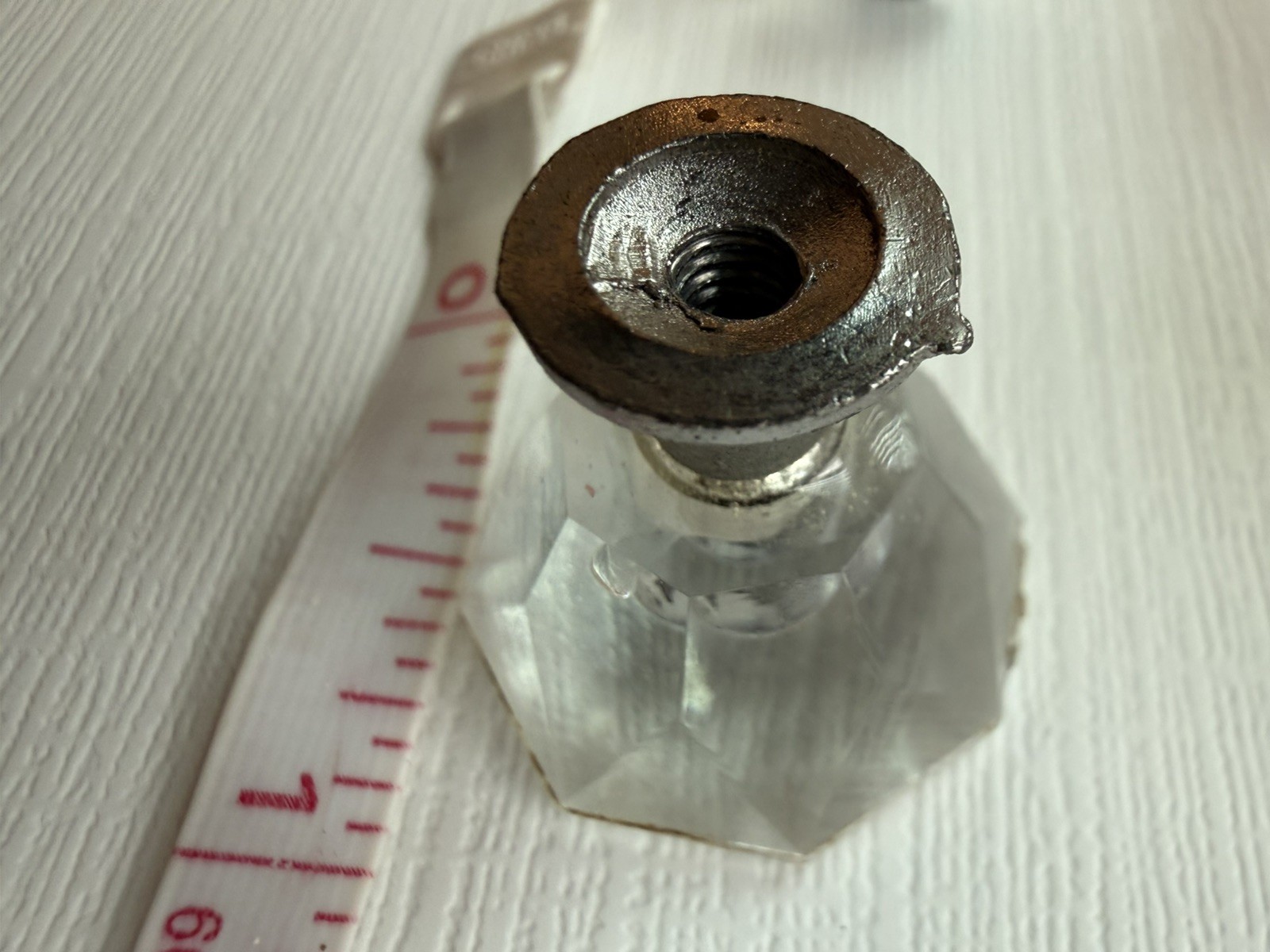 Drawer knobs that are Crystal like. Plastic. Less than 1 inch wide. Quantity 6