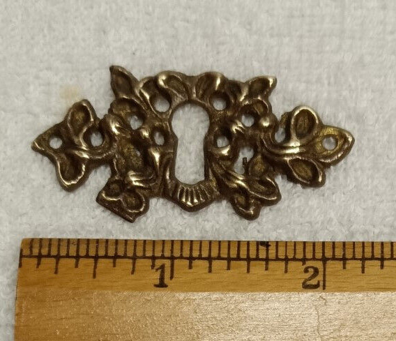 ANTIQUE CAST BRASS ESCUTCHEON OR KEYHOLE COVER,VICTORIAN ERA DESIGN,GOOD PATINA