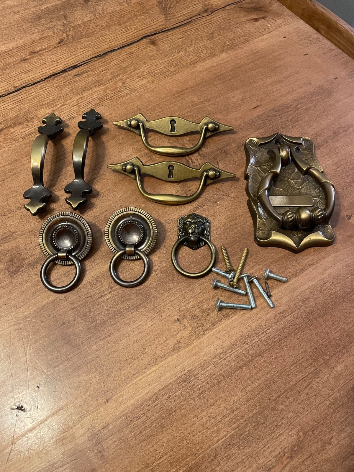 variety of vintage brass pieces, door knock, handles, and pulls never used
