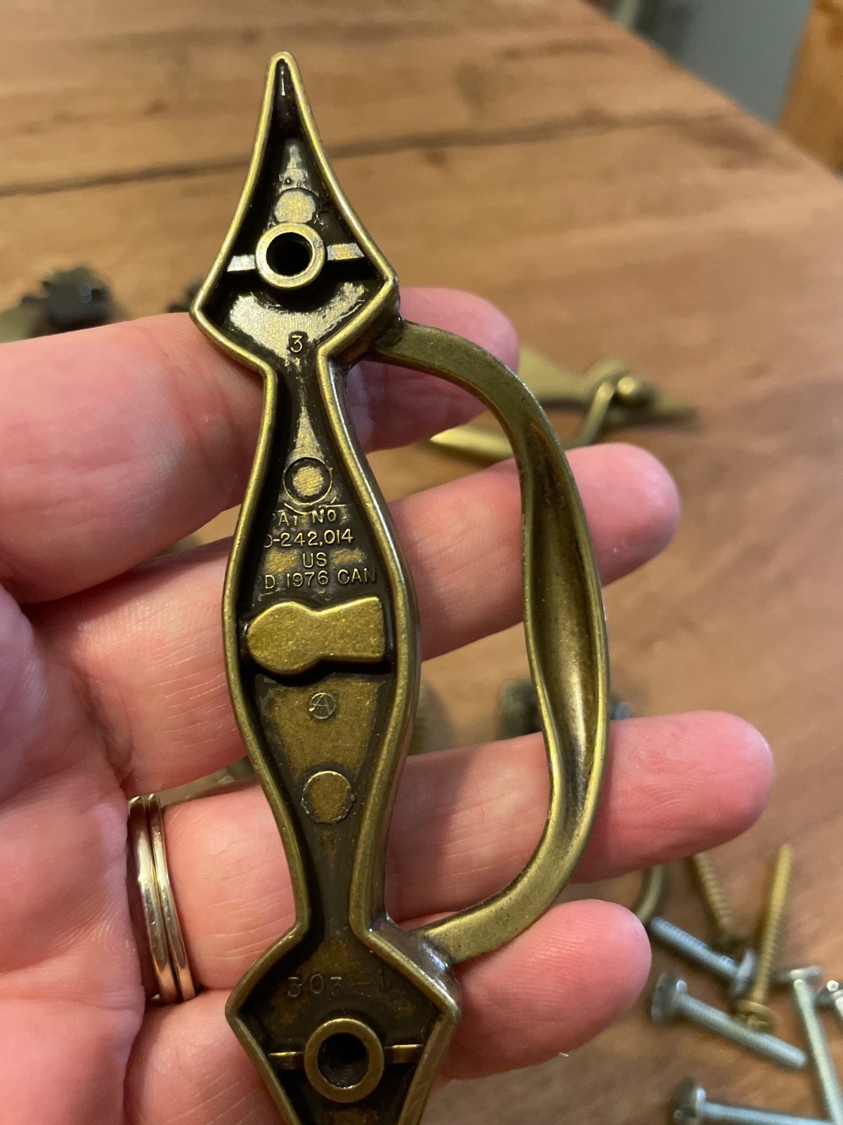 variety of vintage brass pieces, door knock, handles, and pulls never used